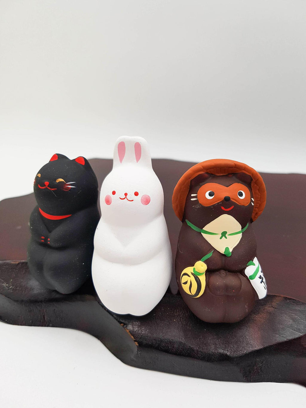 Figurines Osuwari assises en terre cuite et peint Japon fait main artisanal